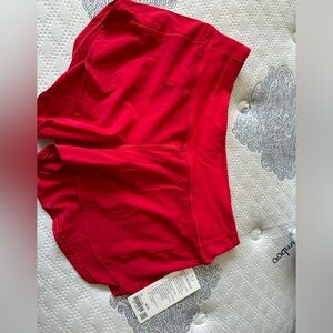 Read size 10 4 inch inseam red. Lululemon shorts.